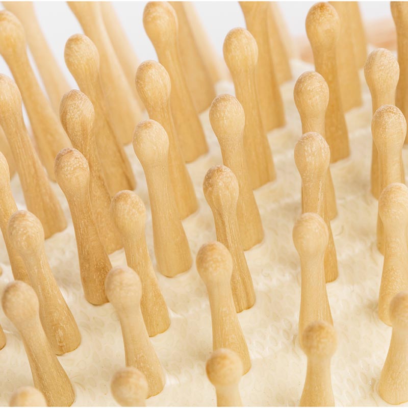 Hairbrush with wooden pins made of beechwood for thick hair