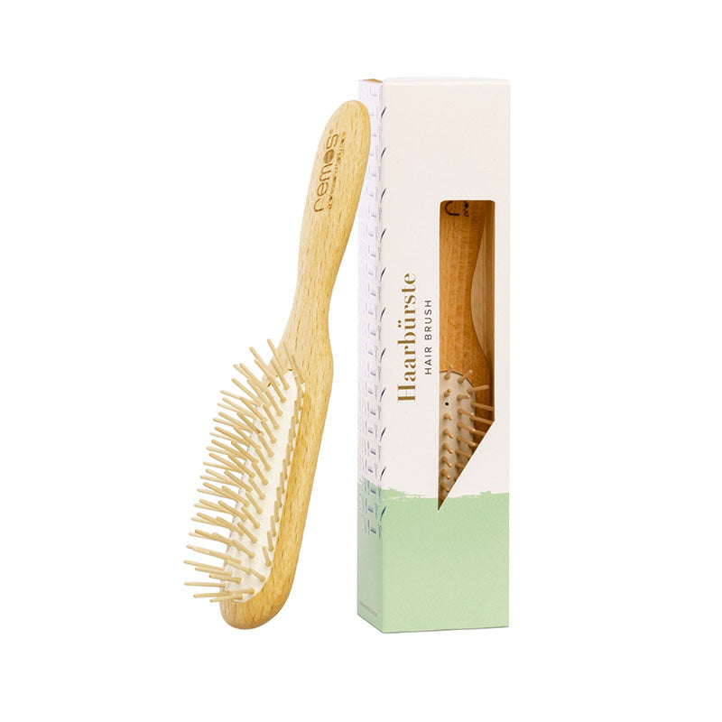 Hairbrush with wooden pins made of beechwood for thick hair