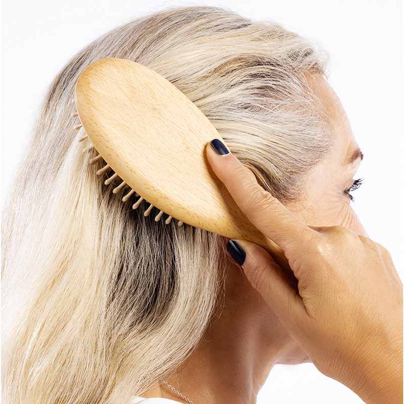 Hairbrush with wooden pins made of beechwood for thick hair