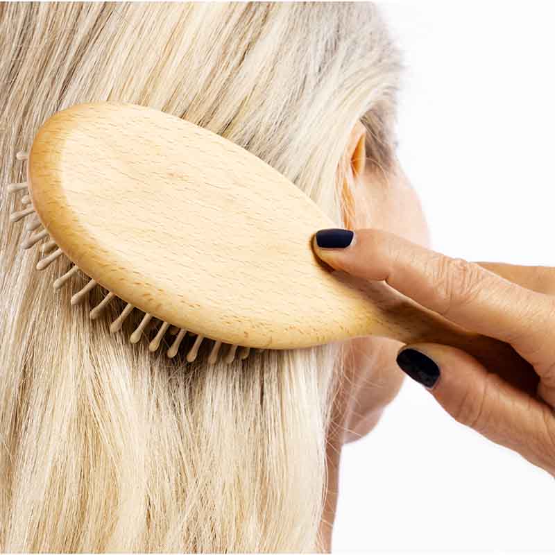 Hairbrush with wooden pins made of beechwood for thick hair