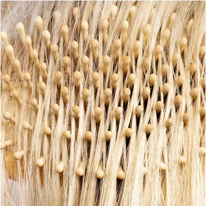 Hairbrush with wooden pins made of beechwood for thick hair