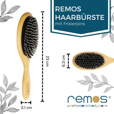 oval Cushion brush with pure black wild boar bristles and nylon pins.